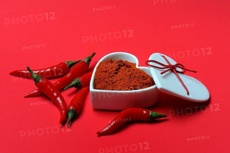 Chili powder in bowl with heart shape