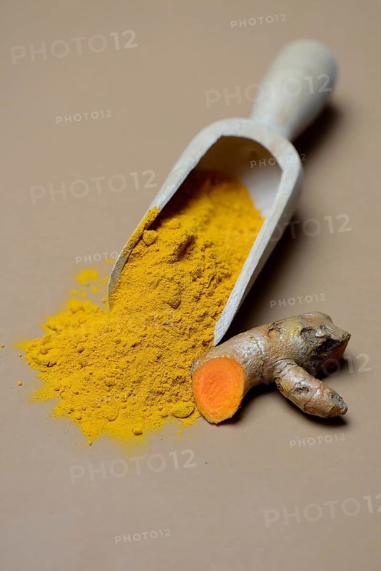 Turmeric-powder in shovel and root