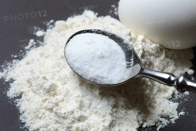Spoon with baking soda and flour and egg