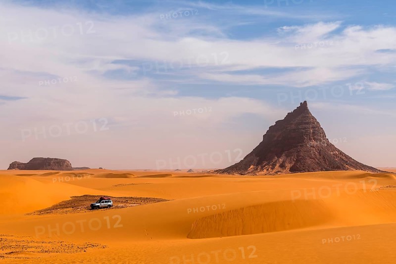 Expedition jeep driving through the desert