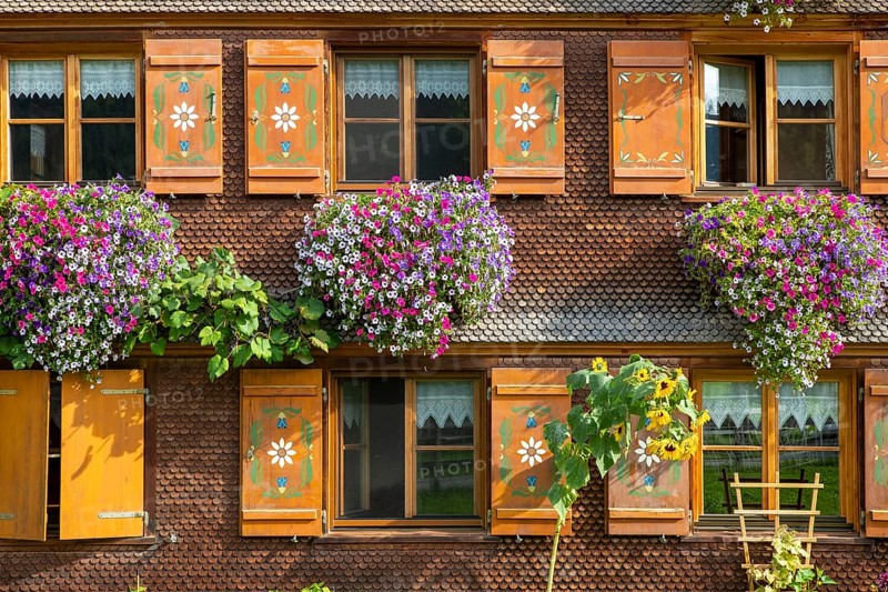 Facade of a Bregenzerwald house with flower decorations
