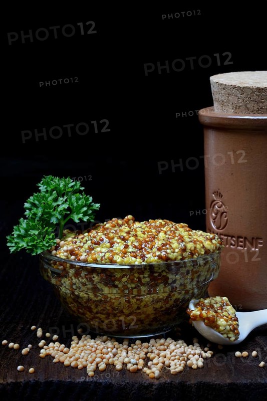 Grainy Dijon mustard in glass bowl