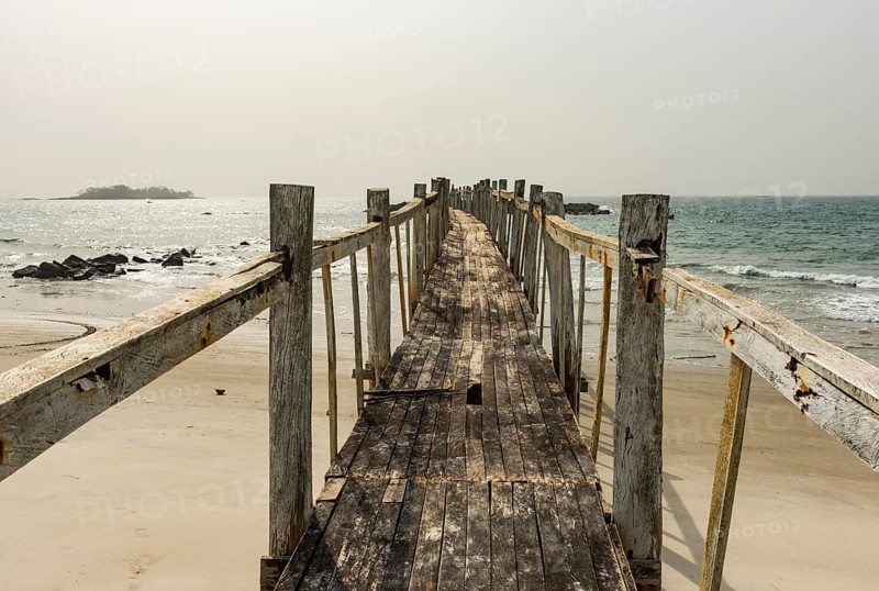 Old wooden pier in the Tokeh Beach