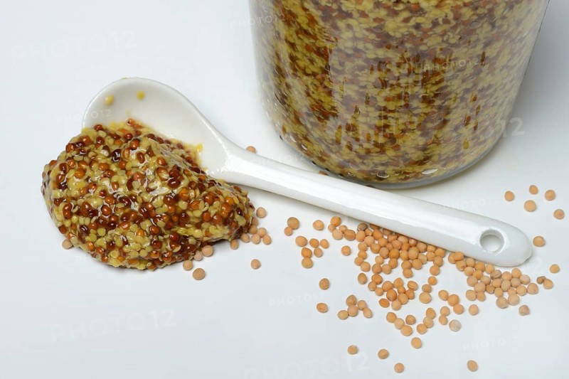 Grainy mustard with porcelain spoon