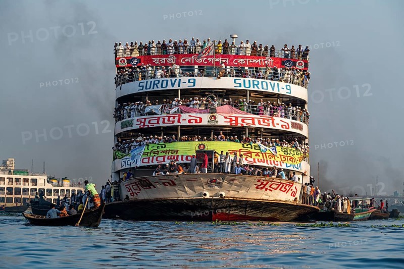 Overloaded passenger ferry with pilgrims on the Dhaka river