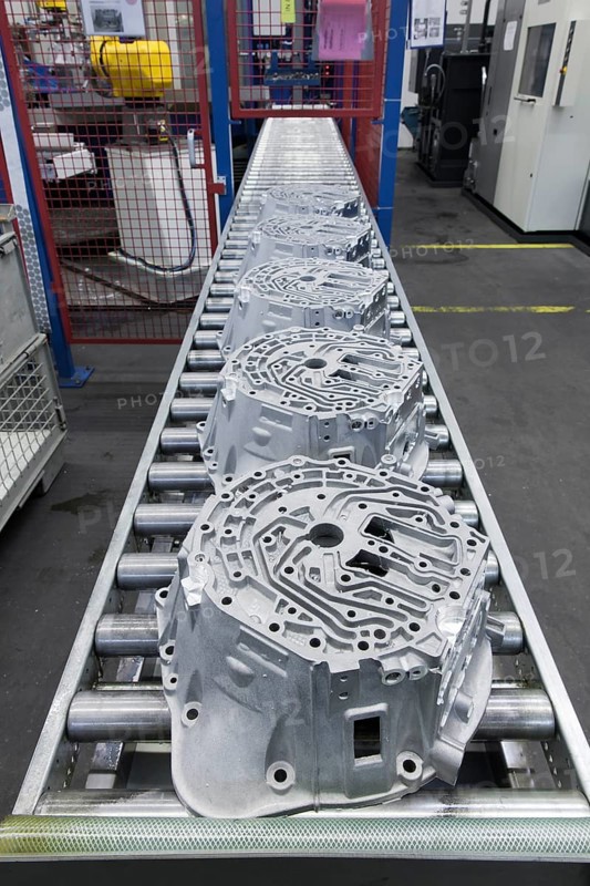 Car parts on a conveyor belt in a car parts factory