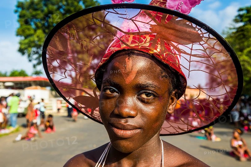 Girl posing at the Carneval in the town of Sao Tome