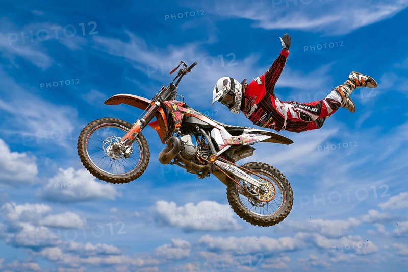 Motocross motorcycle and rider in the air