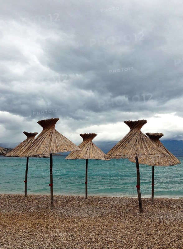Straw parasols on the beach