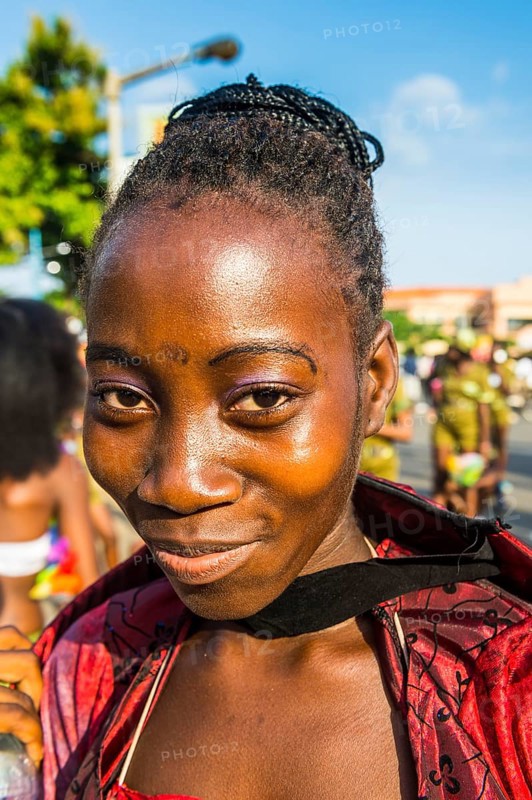 Girl posing at the Carneval in the town of Sao Tome