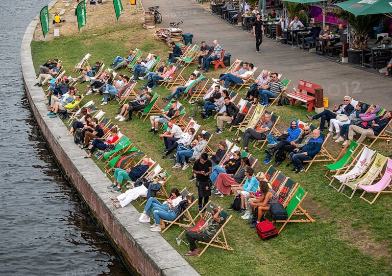 People sitting in deck chairs at the Spree
