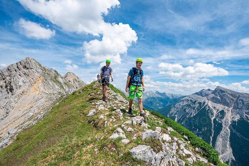 Climber on a ridge at a via ferrata