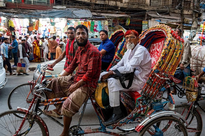 Completely with rickshaws overcrowded street in the center of Dhaka