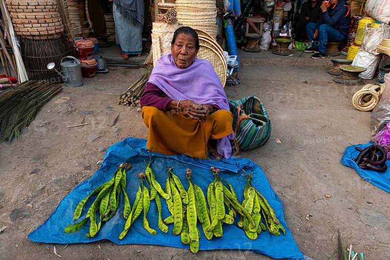 Woman vendor selling vegetables