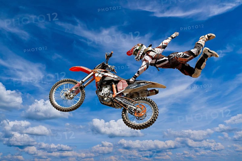 Motocross motorcycle and rider in the air