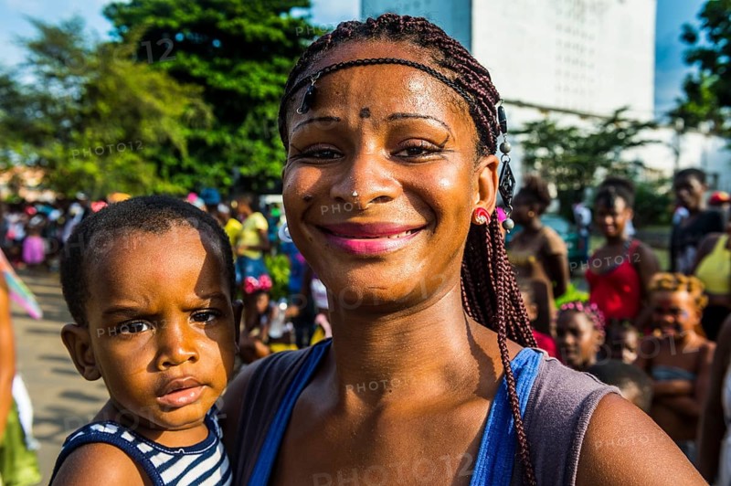 Girl posing at the Carneval in the town of Sao Tome