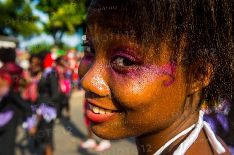 Girl posing at the Carneval in the town of Sao Tome
