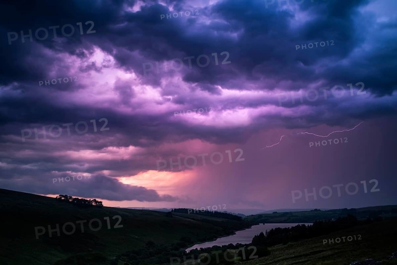 The colors of the storm with thunderbolts on night sky in Brecon Beacons National Park