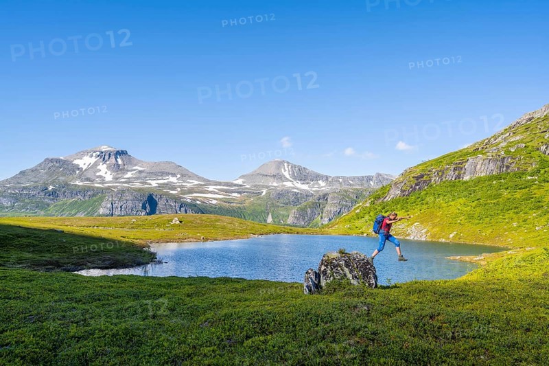 Hiker sprinting from rocks