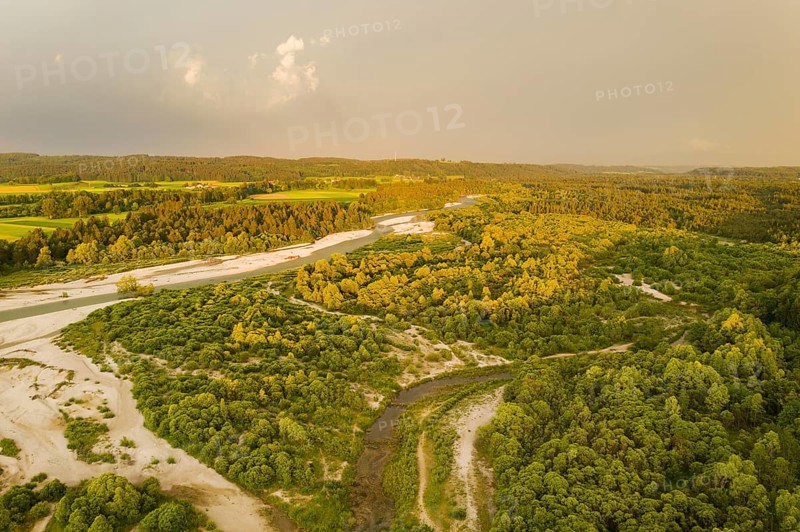 Isar in evening light with rain clouds