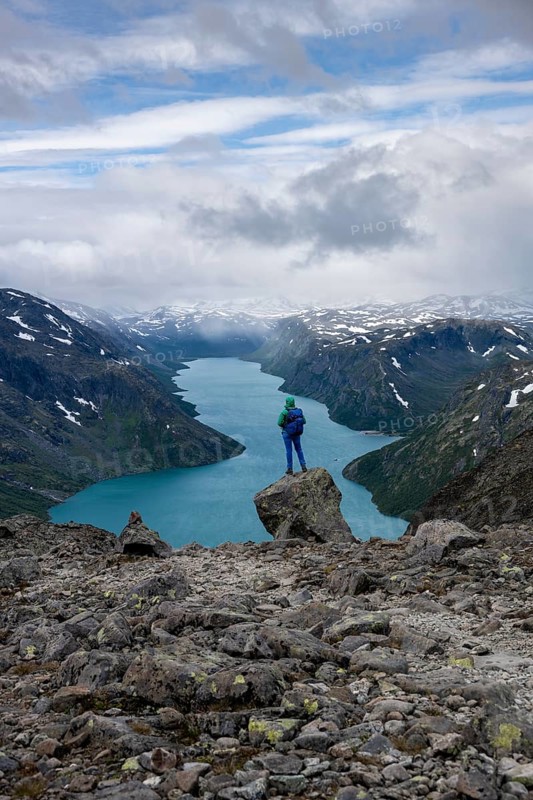 Hiker stands on rocks