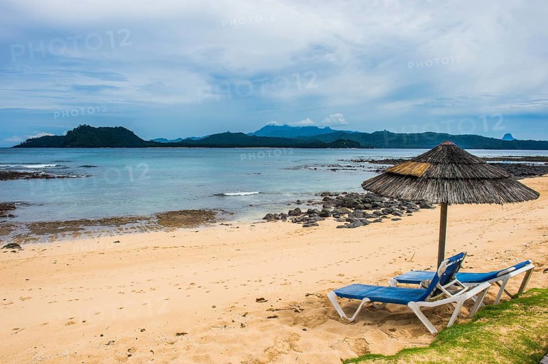 Sun lungers on a sandy beach of a four star hotel in Ilheu das Rolas