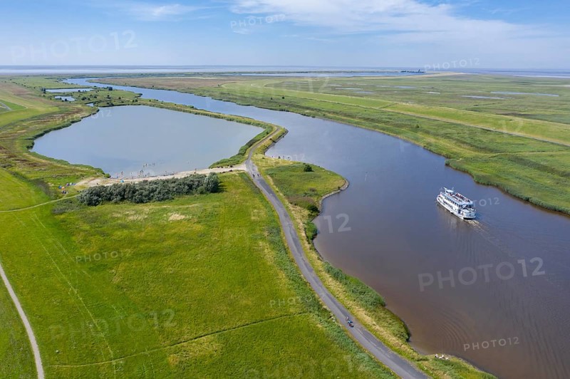 Drone shot with landscape at the Leyhoerner-Sieltief and tourist ship
