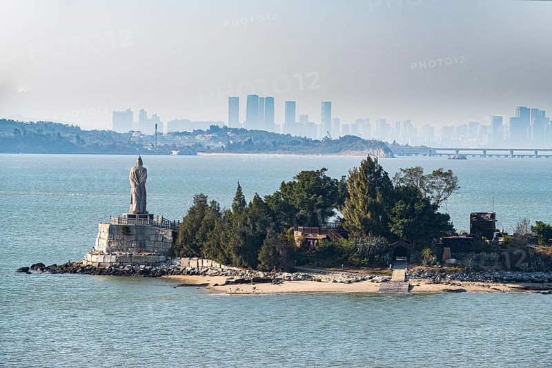 Buddha statue on an island with Xiamen in the background