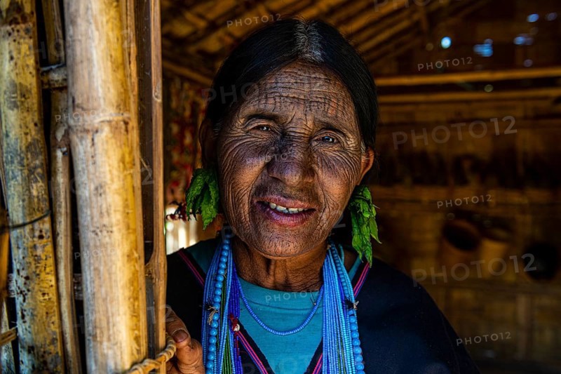 Chin woman with spiderweb tattoo