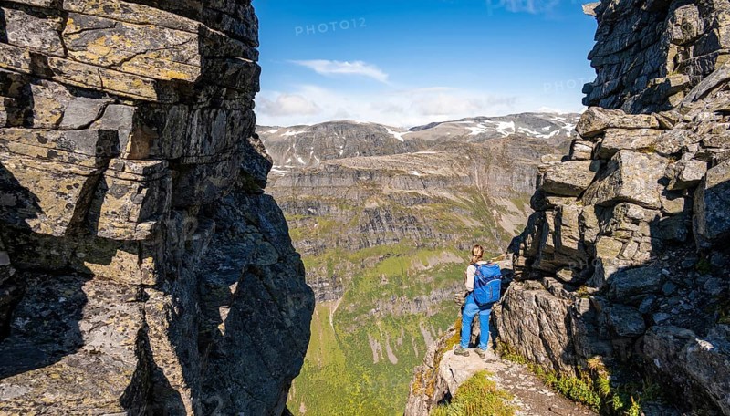 Hiker on a hiking trail to Innerdalstarnet