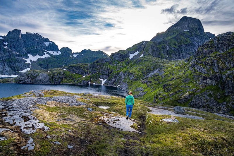 Hiker on a hiking trail to Hermannsdalstinden