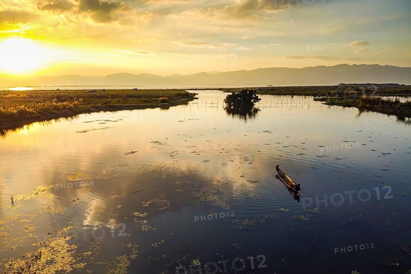 Rowing boat at sunset