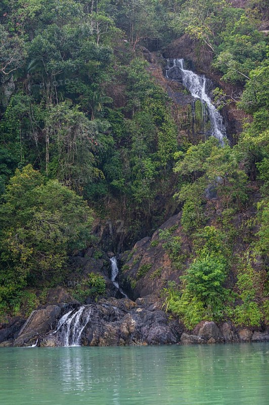 Waterfall dropping right in the ocean on Dome island