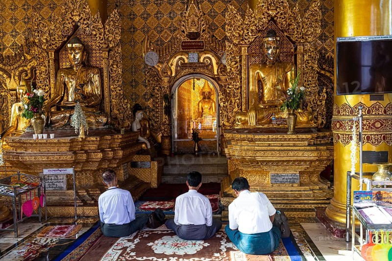 Pilgrims praying in the Shwedagon pagoda