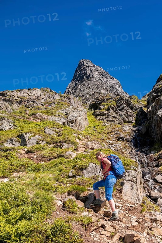 Hiking on a steep trail to Innerdalstarnet