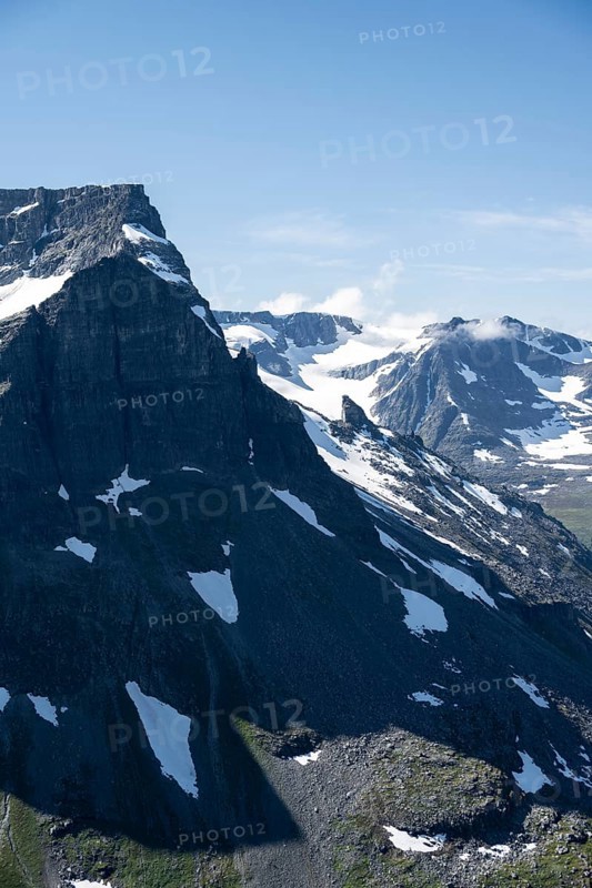 Snow covered mountain slope of Skarfjell mountain and Hesten