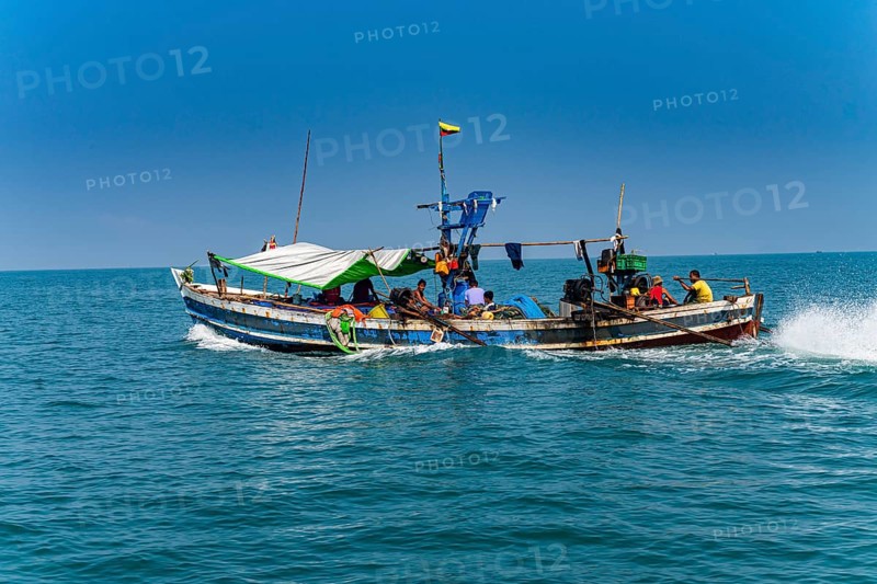 Sea gypsies Moken on their fishing boat