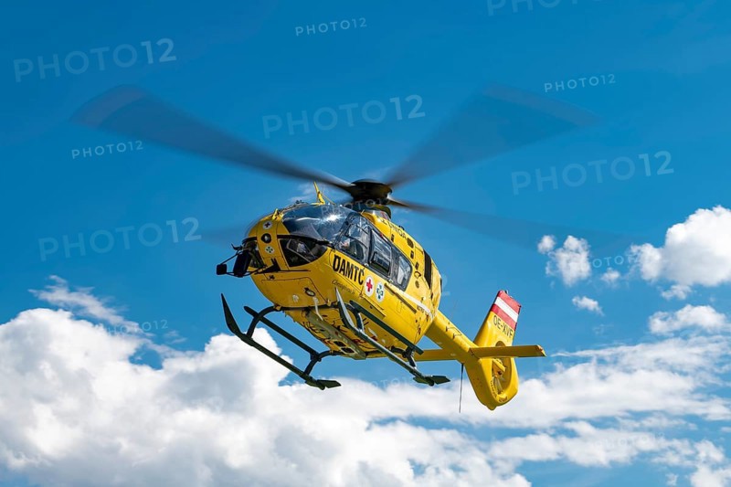 The OeAMTC rescue helicopter Christophorus 14 of the type Eurocopter 135 flies near its base in Oeblarn