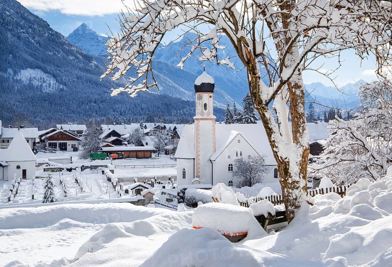Village view with parish church and Karwendel mountains