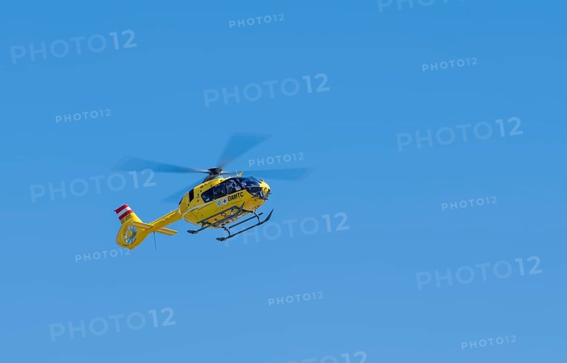 The OeAMTC rescue helicopter Christophorus 14 of the type Eurocopter 135 flies near its base in Oeblarn