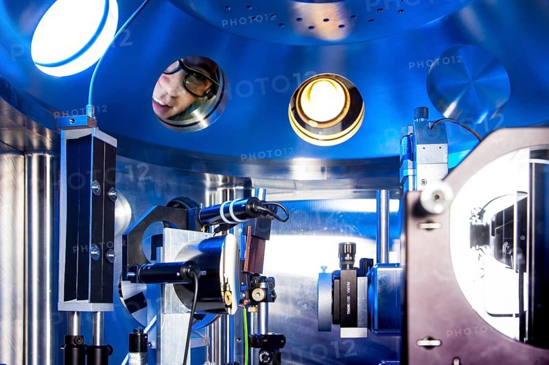 PhD student during his research work adjusting his experimental setup