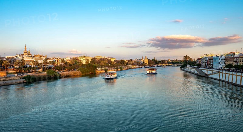 View over the river Rio Guadalquivir with excursion boats