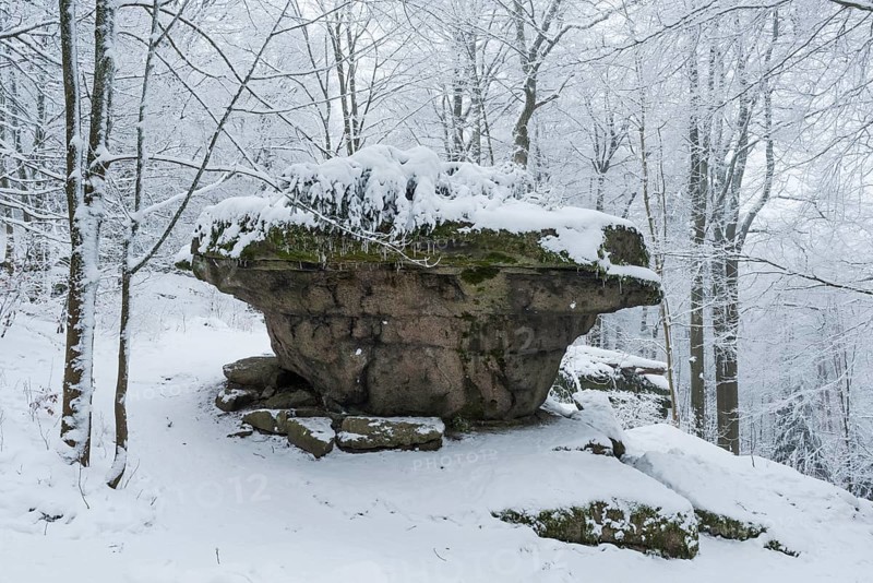 Rock formation Teufelstisch in winter with snow
