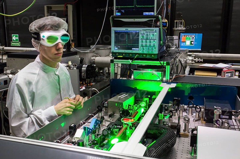 PhD student during his research work adjusting his experimental setup