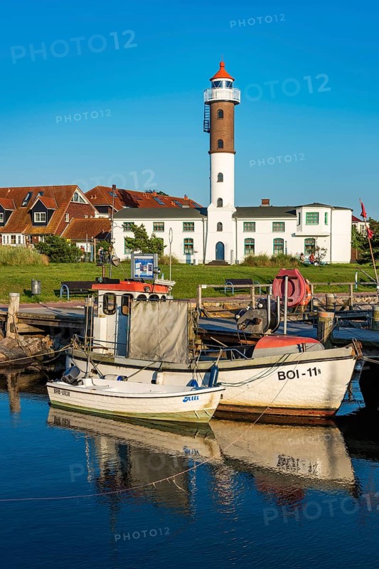 Fishing boats and lighthouse in the harbour of Timmendorf on the island of Poel