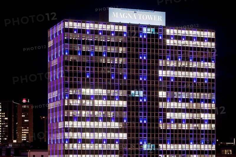 Illuminated Magna Tower in the evening
