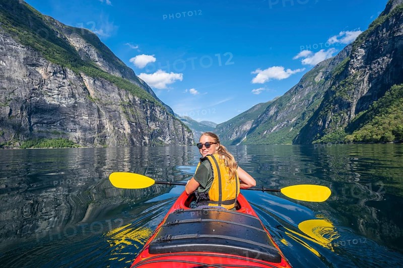 Young woman paddling in a kayak