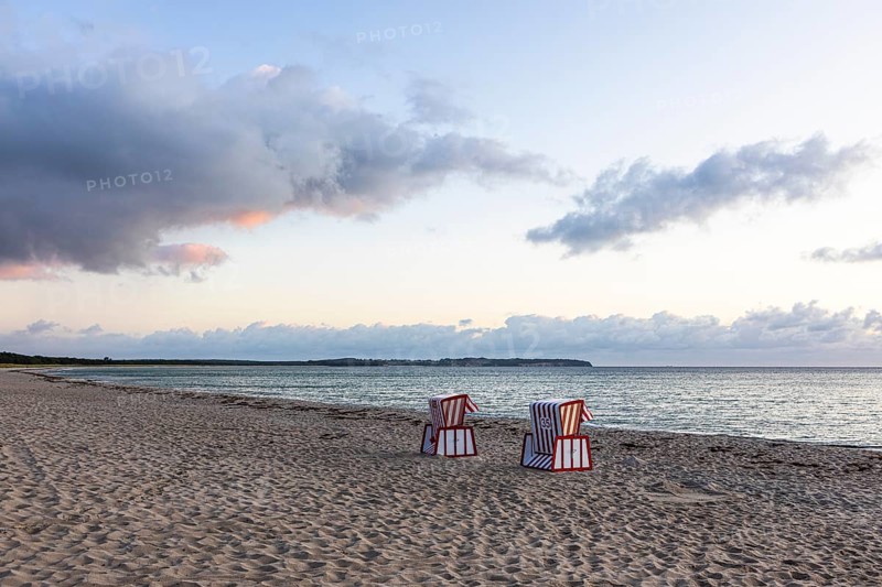 Lonely beach chairs in the morning light at the big beach of Thiessow