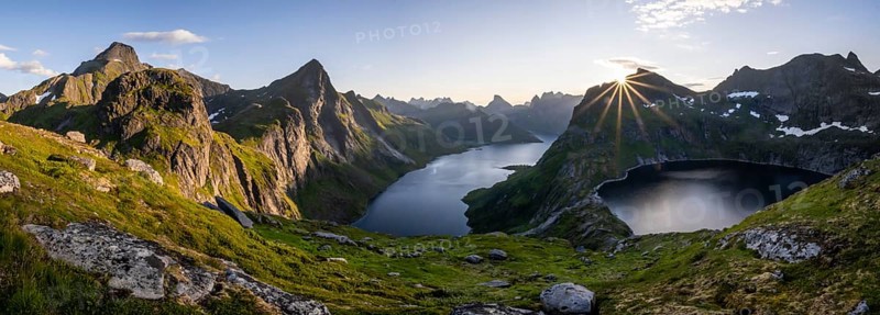 Sun shining over mountain landscape with fjord Forsfjorden and lake Krokvatnet