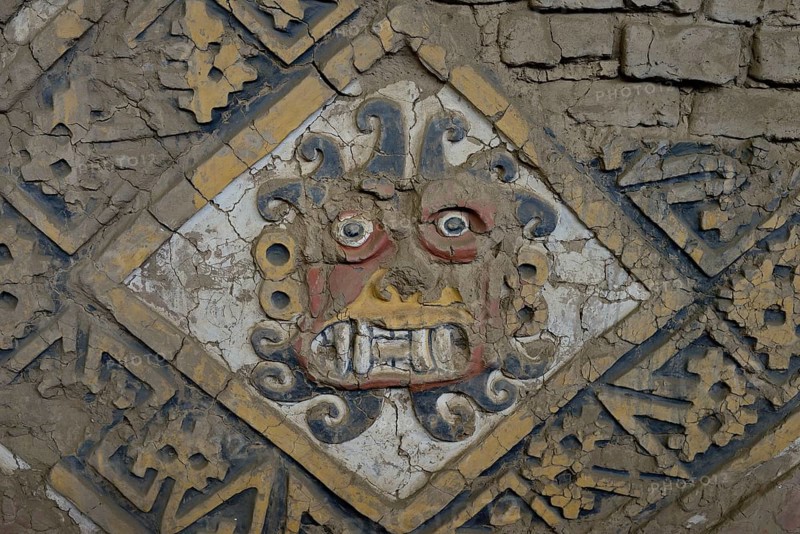 Colourful relief of the Moche culture on adobe walls